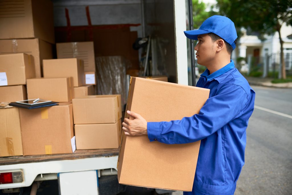 Delivery man loading truck